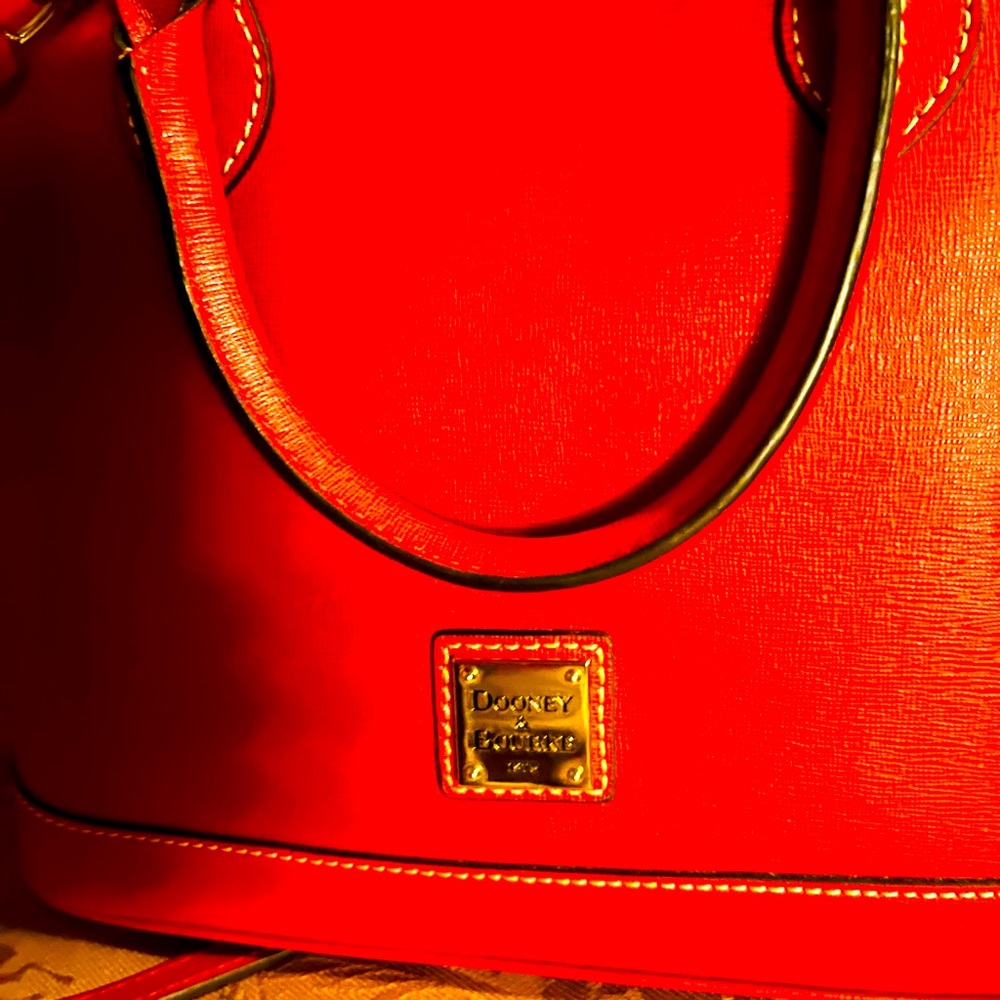 Dooney and Bourke zip zip leather satchel with crossbody adj strap.